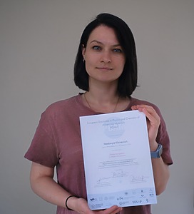 Dr. Nadzeya Khinevich with diploma